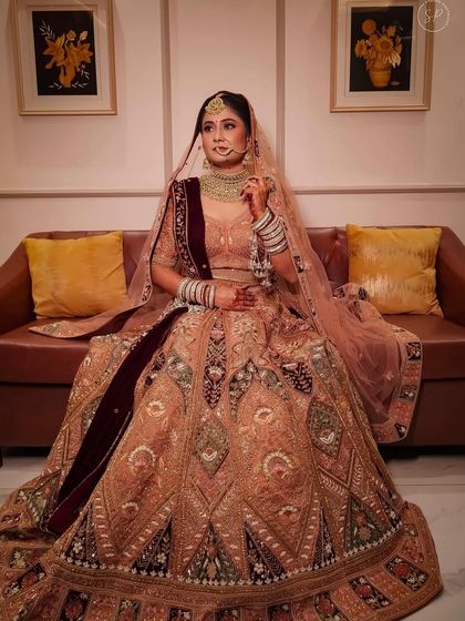 My bride Riya, looking like a princess in her pastel lehenga. The soft makeup and elegant jewellery complete her look perfectly.
