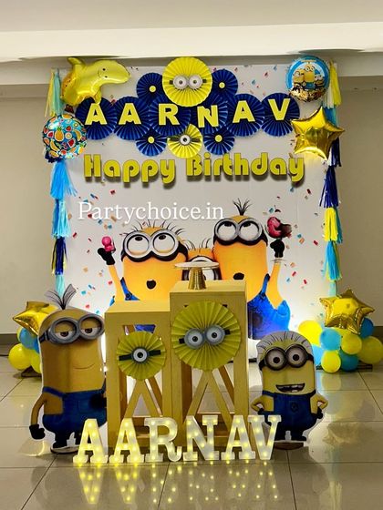 The Minions themed setup complete with light-up marquee letters spelling the birthday boy's name.
