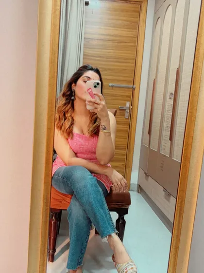 Another angle of the short kurti and jeans combination. It's a timeless look that proves you can be both comfortable and stylish with just a few key pieces from your wardrobe.