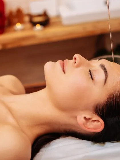 This is a glimpse into a Shirodhara session, a key therapy within Panchakarma. A steady stream of warm, medicated oil flows onto the forehead, calming the entire nervous system. I recommend this treatment for anyone dealing with stress, anxiety, or sleep issues, as it provides profound mental clarity and relaxation.