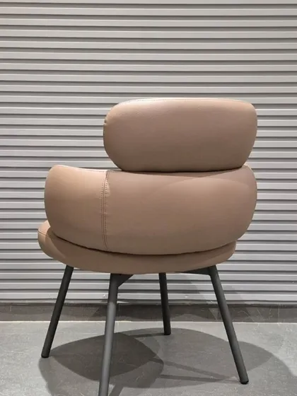 The back view of the tiered chair, highlighting its sculptural quality.