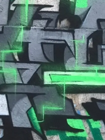A close-up of the "Exploring Realms" piece. The glowing green lines give it a futuristic, digital feel. It's like a glitch in the matrix.