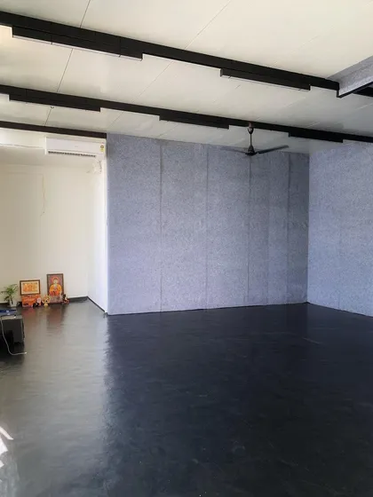 A view of the studio showing the sound-absorbing wall panels, which are crucial for creating the perfect audio environment for our dance and yoga classes.