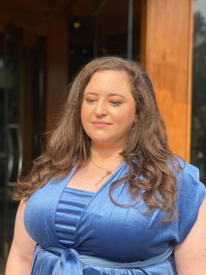 Another portrait of the client, showcasing the subtle and elegant makeup that is perfect for wedding guests of any age.