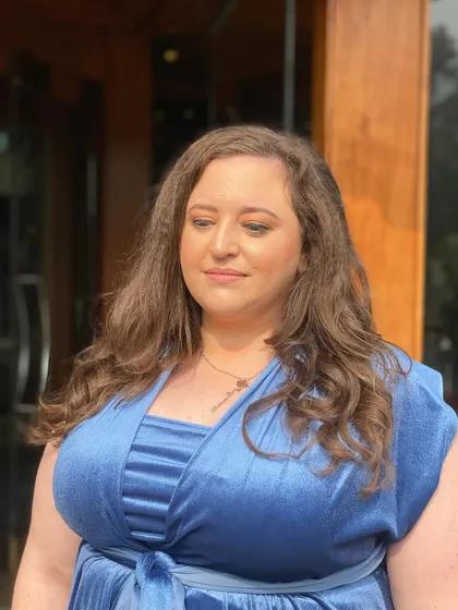 Another portrait of the client, showcasing the subtle and elegant makeup that is perfect for wedding guests of any age.