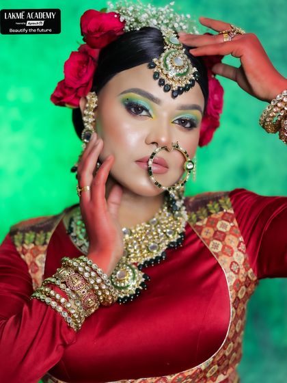 Inspired by high-fashion bridal trends, this look features a bold green eyeshadow against a traditional red outfit. This Sabyasachi-inspired makeup shows how our students learn to blend tradition with runway trends.