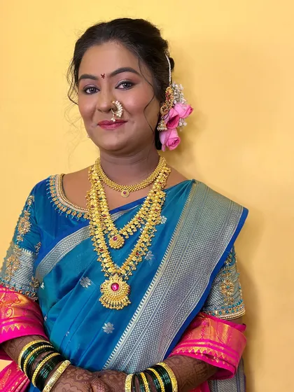 A portrait of the bride in her blue saree, looking radiant.