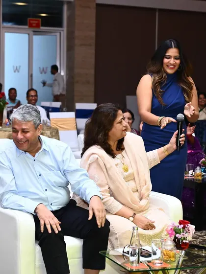 Sharing a light-hearted moment with senior members of SBI Bank. Building a rapport with guests and leadership is a key part of my hosting style.
