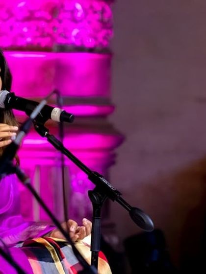 A candid moment during the Bengaluru Ganesha Utsava performance. The stage is my happy place, where I can connect with the audience and my fellow musicians through the language of music.