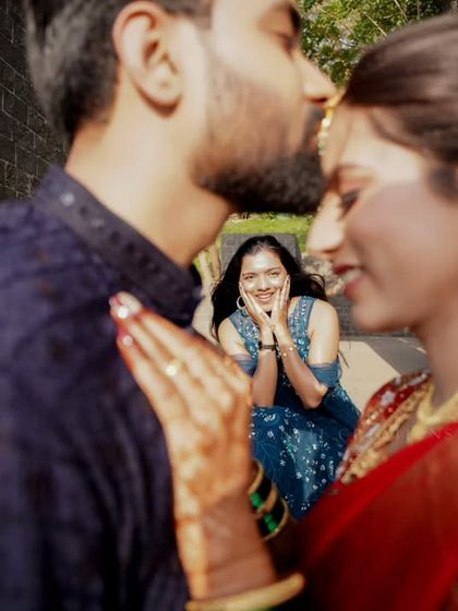 A creative shot with a friend in the background, adding a layer of storytelling to this engagement portrait.