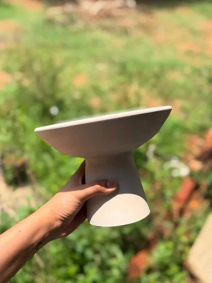 The elegant form of the elevated serving bowl is clear to see even before glazing.