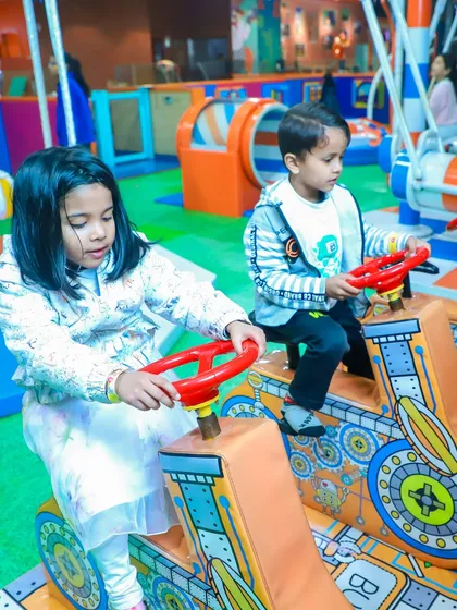 Little drivers enjoying the ride-on toys in our toddler area. These are a safe and fun option for the youngest guests at any party.