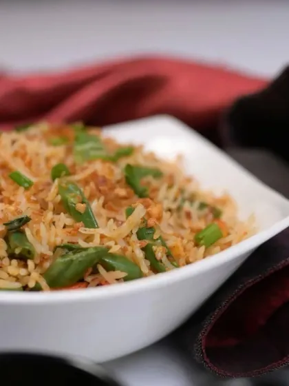 Elevate your meal with the bold and aromatic flavors of our Burnt Garlic Fried Rice. Crispy garlic and perfectly stir-fried rice create a savory kick you'll love.