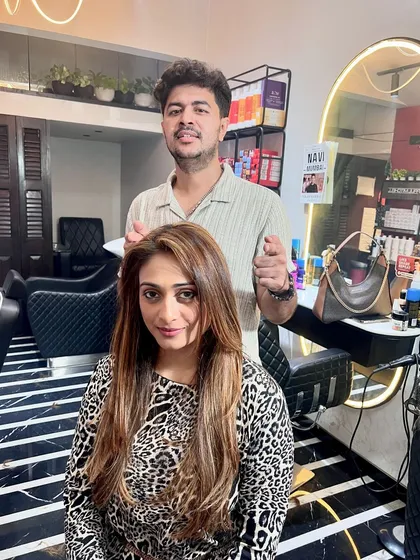 Here I am with the client after her transformation. A successful color service is all about collaboration and ensuring the final look matches the client's personality and style.