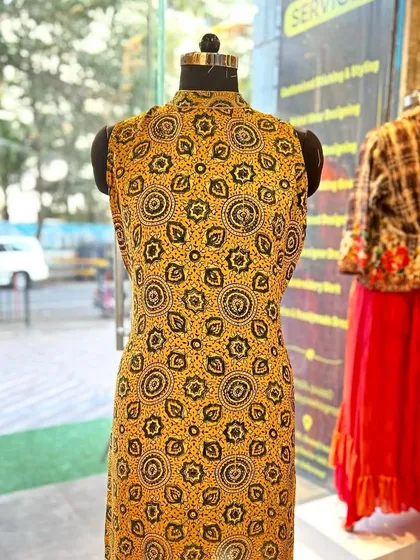 An Ajrakh print short kurti with intricate neck work embroidery. This is a great example of how I elevate simple kurtis with personalized, handcrafted details.