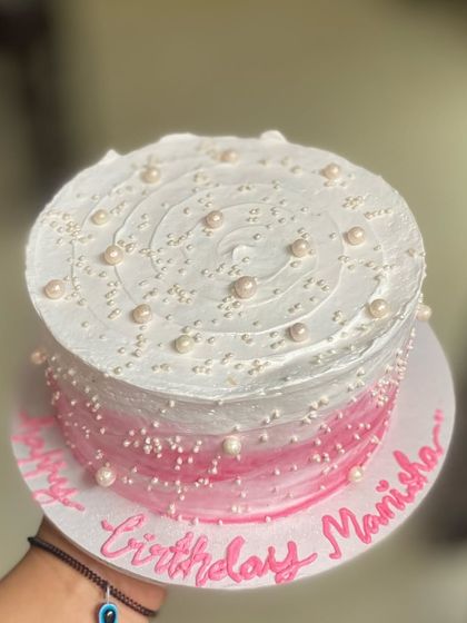 Happiness is extra sprinkles. This pink ombre Black Forest cake is covered in pretty pearl sprinkles for a touch of glam.