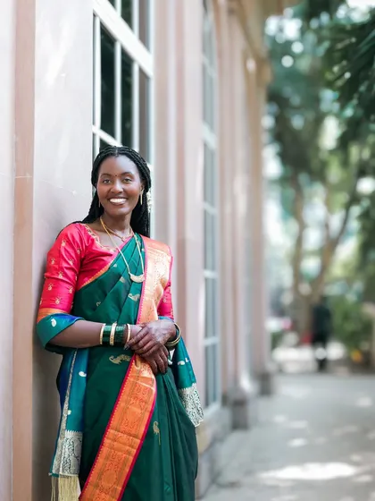 Elegance and grace. A beautiful portrait of a woman in a traditional Indian saree, showcasing the beauty of cross-cultural celebrations.