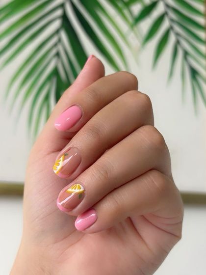 The pink and lemon nail art looking fresh and vibrant.