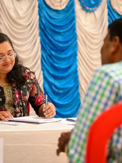 Here I am during a free health camp, providing a consultation. I believe in making Ayurvedic care accessible and am committed to community health initiatives.