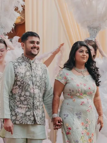 Hand in hand, the couple walks in, ready to greet their guests and start the celebration.