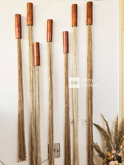 The beauty is in the details. The contrast between the dark wood and the light, natural fibers gives this piece a unique character. It's perfect for adding texture to a minimalist space.