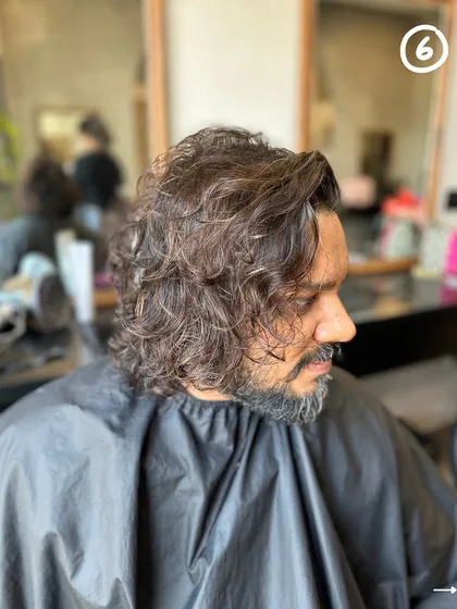 A great example of a men's haircut, showing how I work with wavy texture to create a stylish, lived-in look.