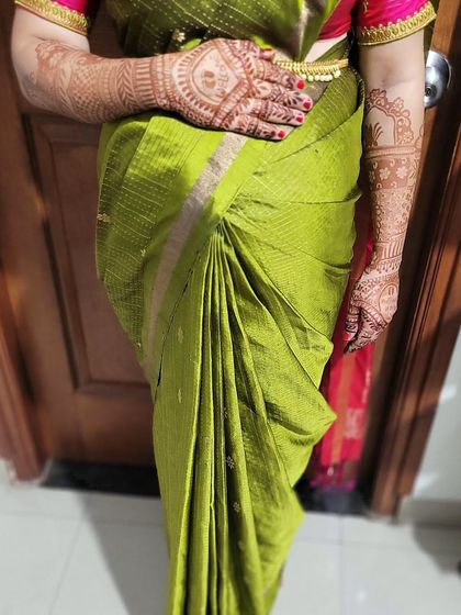 A close-up of the drape for new mom Sowmya, showing the neat pleats and comfortable fit. The focus is on practical elegance.