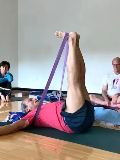 Teaching Supta Padangusthasana with a strap at a workshop for Yoga Mart practitioners at the YMCA.