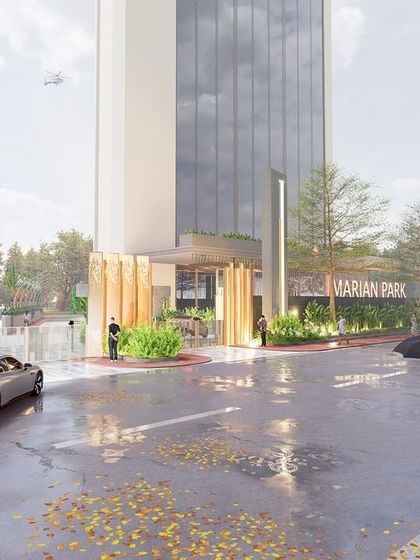 The main entrance to Marian Park in Mangaluru, where golden metallic fins create a visually striking and luxurious gateway. The design establishes a strong street presence, hinting at the sophisticated blend of architecture and landscape within the property.
