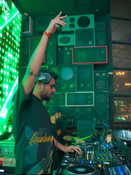In the zone at Bombay Adda, Bengaluru. With the VDJ screen lighting up behind me and a wall of speakers ready to go, I'm focused on delivering a high-impact Bollywood bass set.