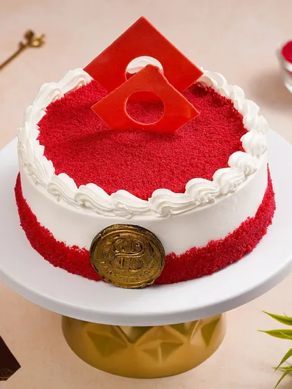 A vibrant red velvet cake on a golden cake stand, shot for a Zomato or Swiggy menu. Our menu photography is clean, bright, and designed to make customers order.