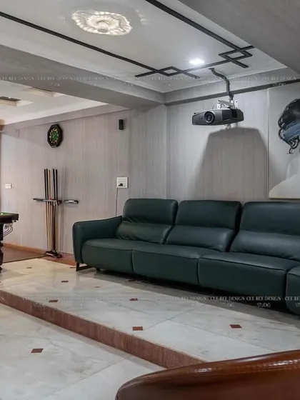 Another view of the entertainment room from image 152, showing the projector setup and overall layout.