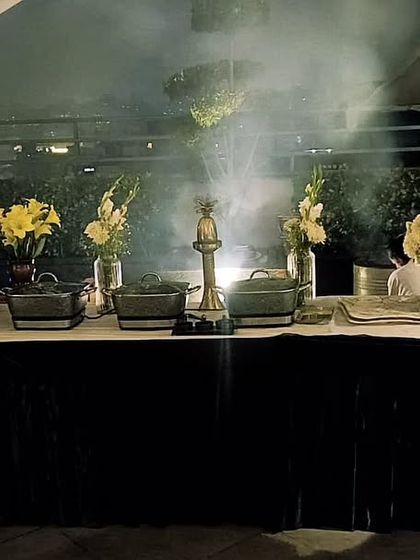 A New Year's Eve catering event with a smoky, atmospheric buffet setup. I love creating memorable experiences with delicious food to mark special nights like this.