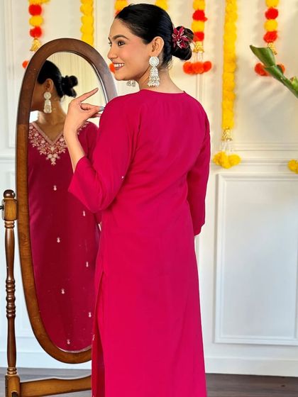 This rani pink kurta set is a classic festive look. The jacquard woven dupatta and thread embroidery on the kurta make it rich and celebratory.