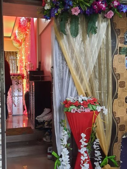 The entrance to a house decorated for a function. The decor continues from the outside to the inside, creating a seamless experience.