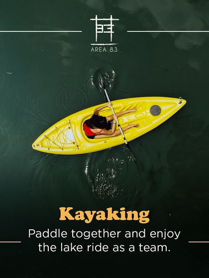 Paddle together and enjoy the lake ride as a team. This aerial shot shows a solo kayaker enjoying the calm water.