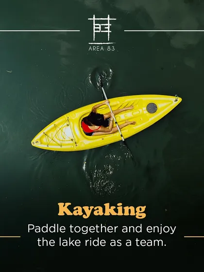 Paddle together and enjoy the lake ride as a team. This aerial shot shows a solo kayaker enjoying the calm water.