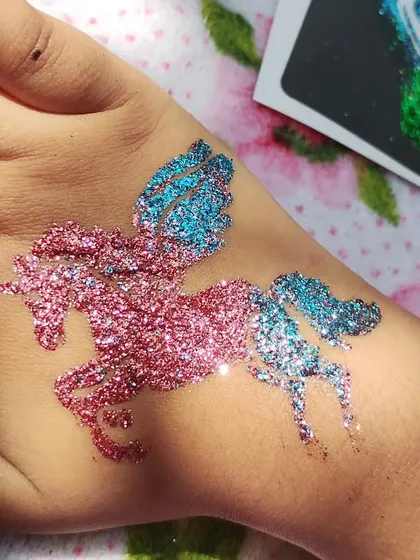 Unicorns are always a favorite. This magical winged unicorn, or Pegasus, is created with a beautiful blend of pink and blue glitter, making it a dream come true for any unicorn-themed birthday party.