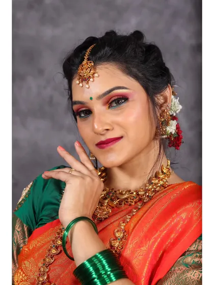 A playful and expressive portrait, using the hands and bangles to create a dynamic composition that showcases the joy of dressing in traditional wear.