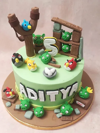 We bring the classic game to life with this Angry Birds cake, complete with a slingshot, pigs in their wooden fort, and all the main bird characters.