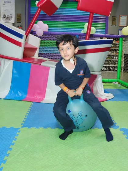 Bouncing around on a hopper ball is just one of the many fun activities available in our play area.