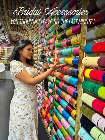 Here I am at a bangle store, surrounded by a rainbow of colors. Choosing the right bangles is a key part of the styling process, and I make sure it's a fun and stress-free experience.