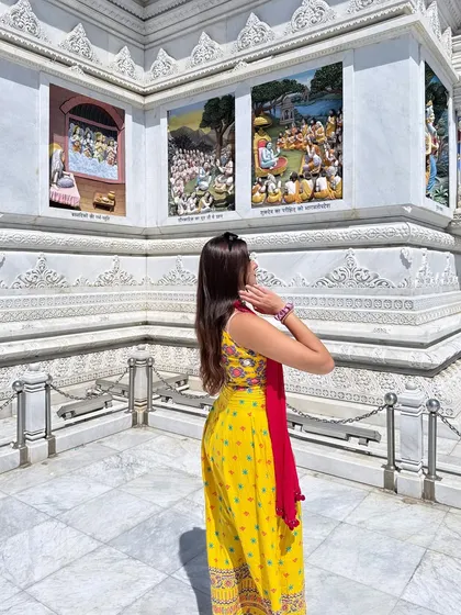 Admiring the intricate carvings on the temple walls. This shot connects my traditional attire with India's rich cultural heritage.