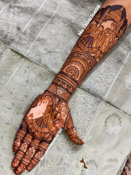 A close-up of a single arm, featuring a bride's portrait on the palm and a wedding ceremony on the forearm.