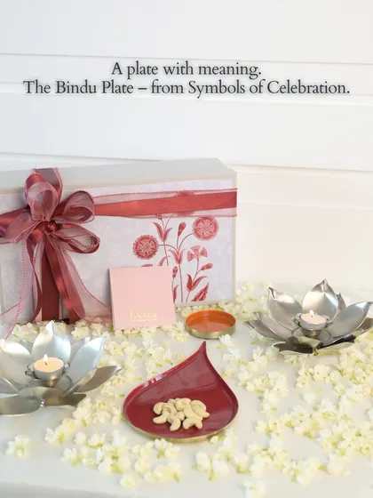 The Bindu plate, from our 'Symbols of Celebration' collection, is designed with meaning. Here it is shown as part of a complete gift set, with lotus diyas and a beautiful floral box, perfect for festive gifting.