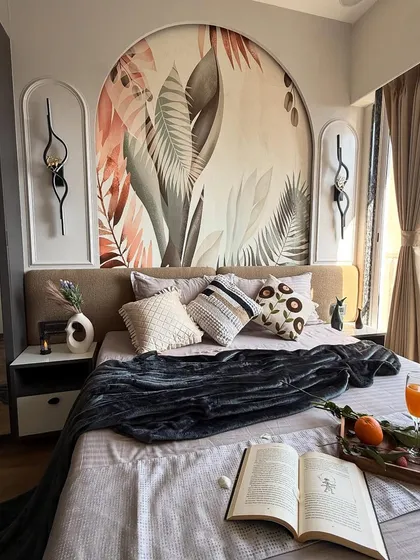 The complete master bedroom, featuring a large arched wallpaper panel behind the bed, creating a stunning focal point. The room is styled to feel like a luxury retreat with a view of the Mumbai skyline.