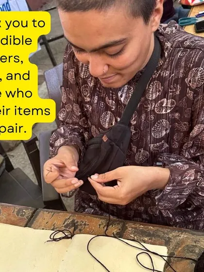 A participant learns the art of bookbinding, carefully stitching pages together. This skill is a beautiful way to repair old books or create new journals from scratch.