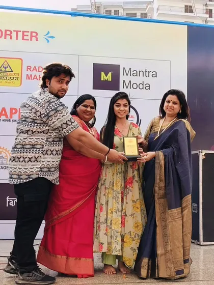 On stage receiving an award as Guest of Honour. I am always happy to support and encourage upcoming talent.