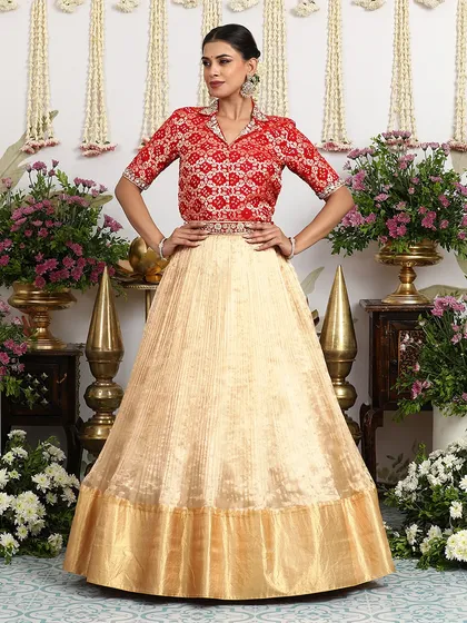 This pose showcases the grand flare of the silk lehenga skirt, a key feature of our designs.
