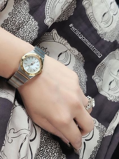 Accessories are the finishing touch. A classic, dual-tone watch is a power piece that adds polish to any look, whether it's for a corporate meeting or a casual outing.